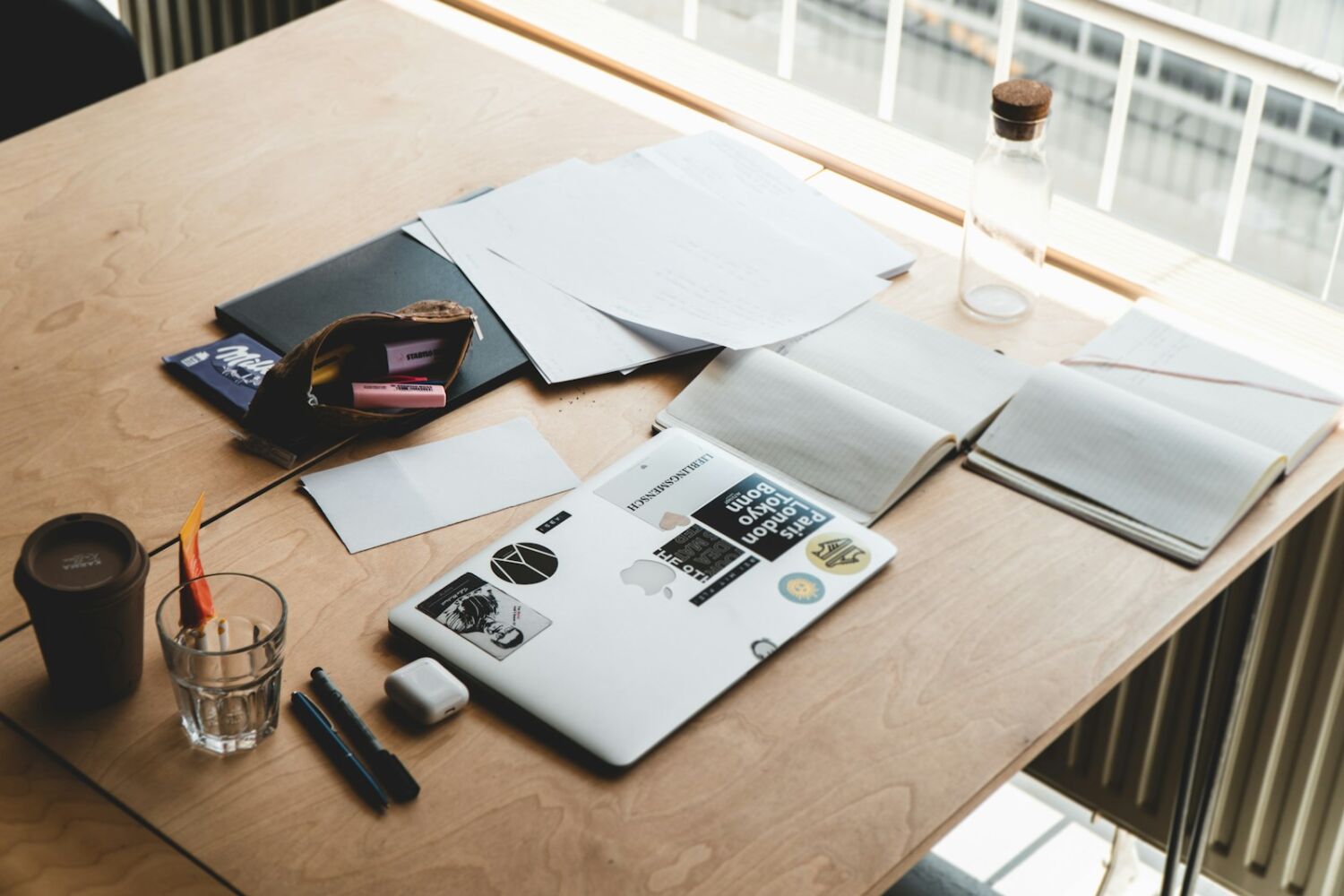 macbook pro on brown wooden table